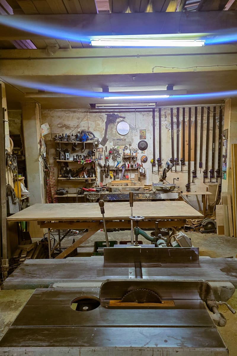 A carpentry workshop full of tools and workbenches.