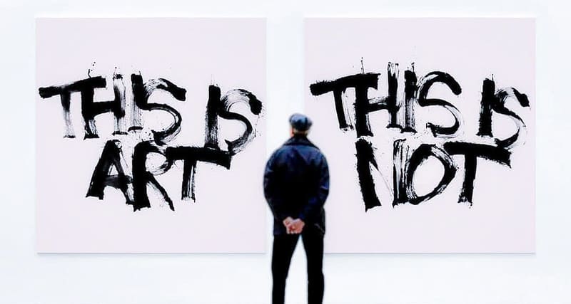 A man standing between two canvases that read "This is art" and "This is not".